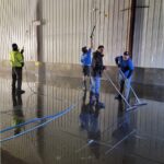 4 worker cleaning a storage warehouse