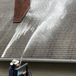 Soft Washing a roof with shingles. 